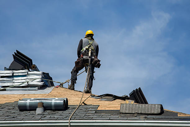 Professional Roofing technician working in Reasnor, IA